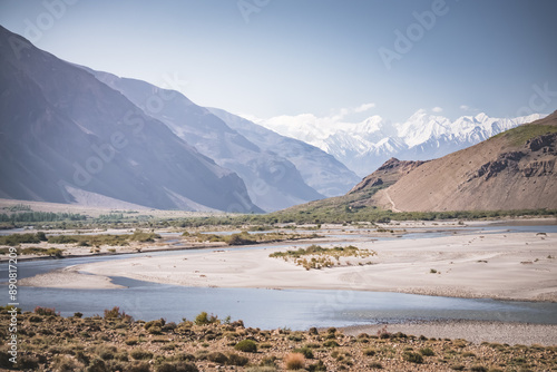 Panoramic landscape in Tien Shan mountains in Pamir with Panj river and mountains in Afghanistan and Tajikistan, sunny morning landscape for background photo