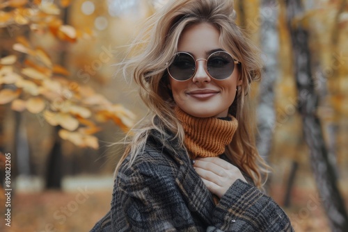 Smiling Woman in Plaid Jacket With Autumn Leaves in Background