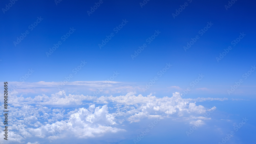 Horizontal gradient blue sky with white fluffy clouds Horizontal gradient blue sky with white fluffy clouds