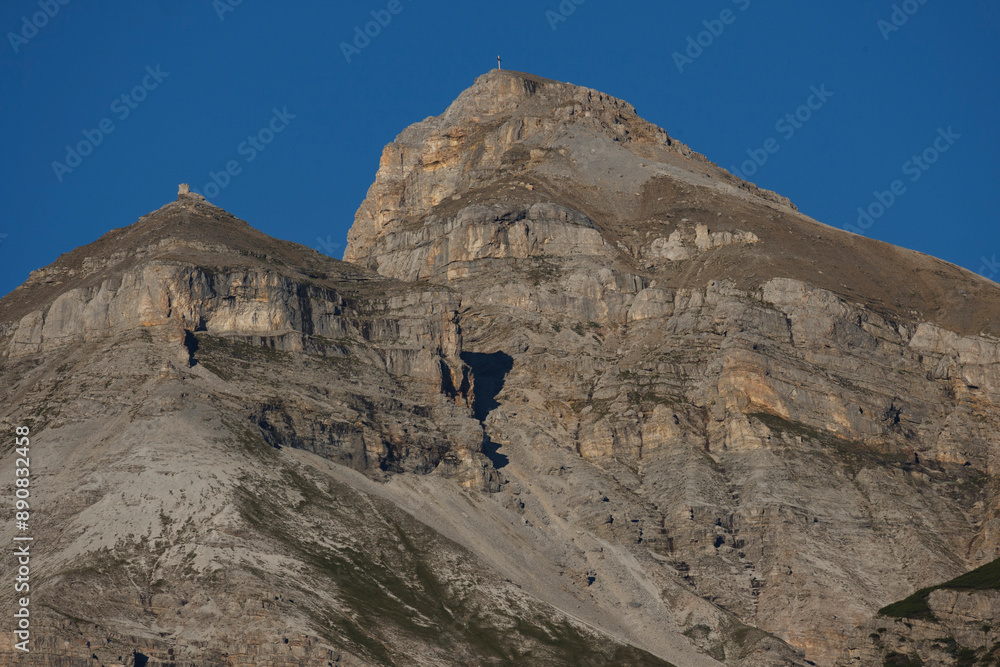 Fototapeta premium Serles Mountain in Stubaital stands tall during a summer sunset, showcasing a stunning view in Tyrol, Austria.