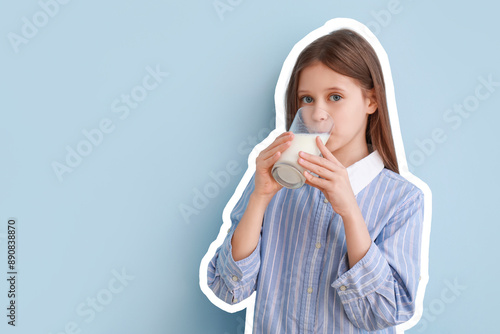 Little girl drinking milk o...