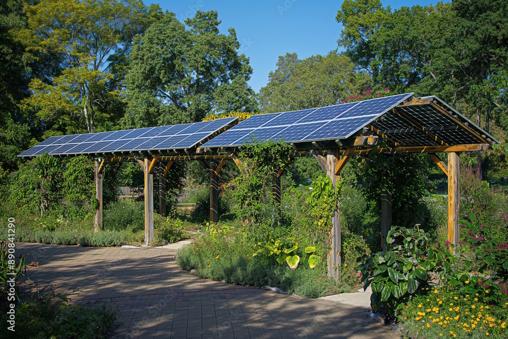 Solar panel shelters in a green park under sunlight. Concept for renewable energy and sustainable public spaces Solar panel shelters in a green park under sunlight. Concept for renewable energy and sustainable public spaces