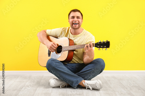 Handsome man playing guitar...