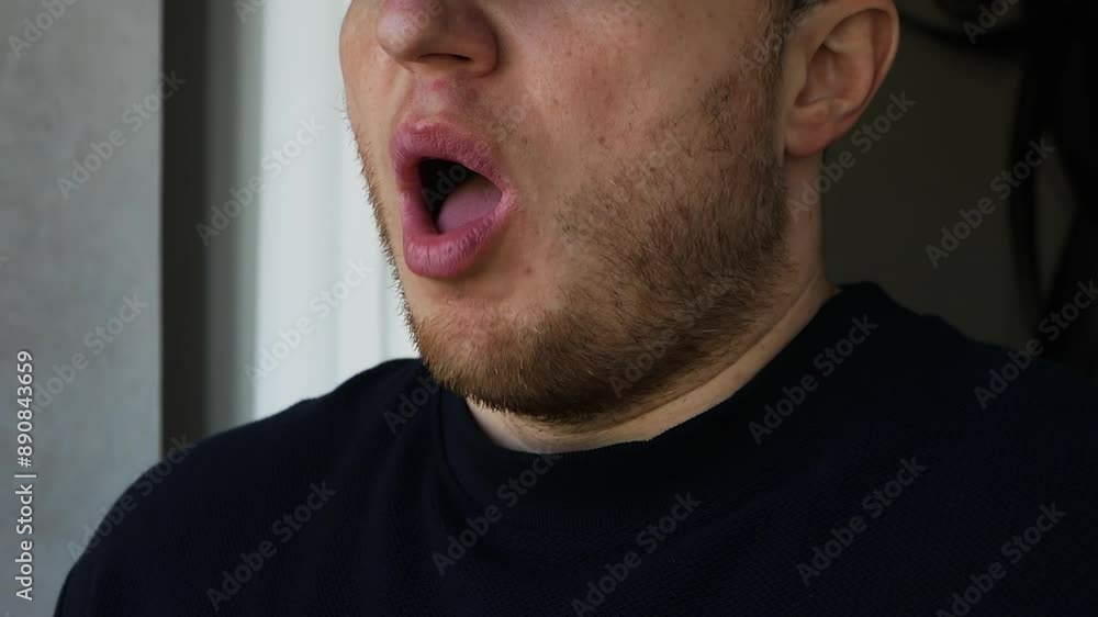 A man sneezes loudly. A young guy has a cold, a flu. Virus is a bacterial disease. A man sneezes loudly. A young guy has a cold, a flu. Virus is a bacterial disease.