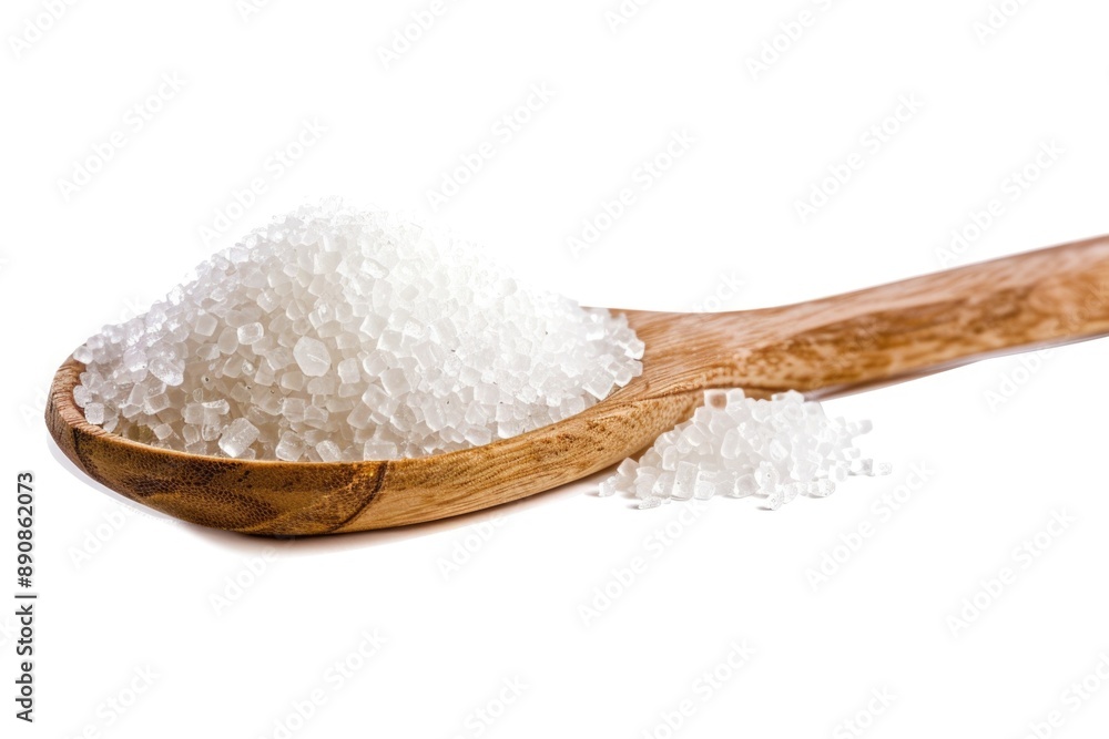 A wooden spoon filled with white sugar, great for baking and cooking A wooden spoon filled with white sugar, great for baking and cooking
