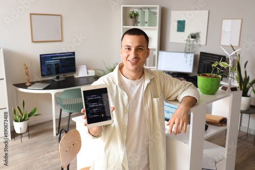 Handsome programmer with ta...
