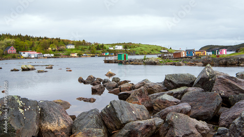 The view from Beaver Pond Brook encompasses New Perlican Harbour, showcasing the vibrant fishing stages dotting the coastline of Bay de Verde Peninsula in Avalon, Newfoundland.
 photo