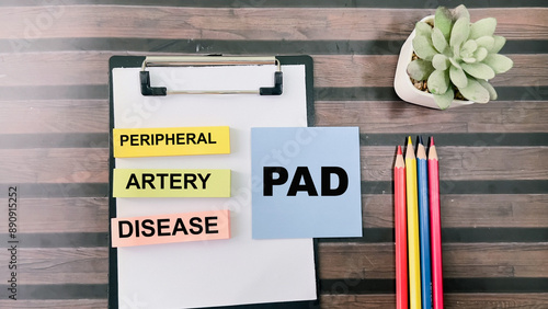 Photography Concept of PAD - Peripheral Artery Disease write on sticky notes isolated on Wooden Table
