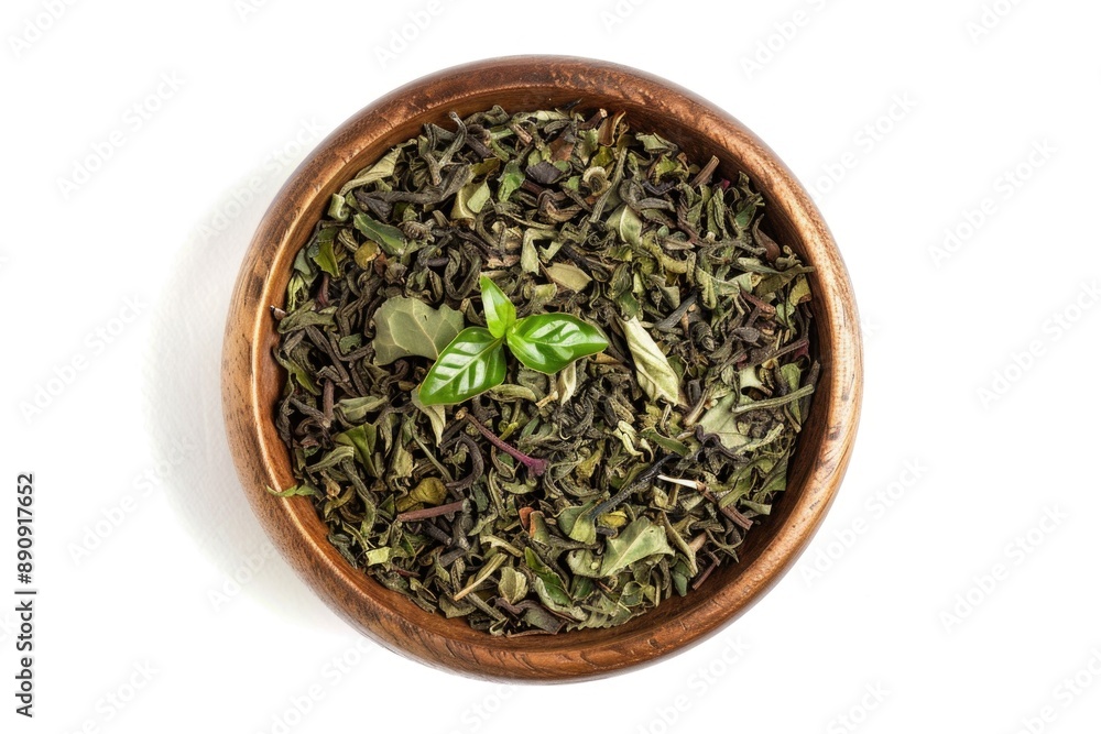 A traditional Asian-style wooden bowl filled with fresh green tea leaves, perfect for serving and brewing A traditional Asian-style wooden bowl filled with fresh green tea leaves, perfect for serving and brewing