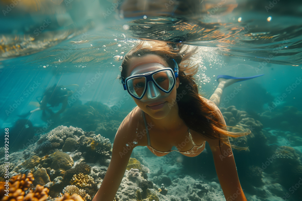 Fototapeta premium Underwater Exploration in the Java Sea: A Woman's Dive Through Crystal-Clear Waters