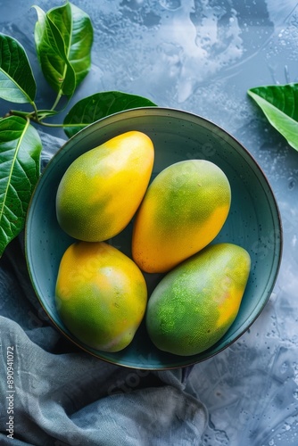 Fresh Manalagi Mango in a bowl, Top View photo