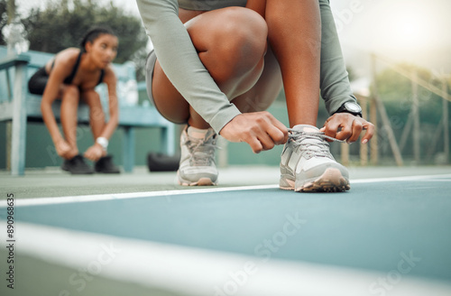 Workout, women and hands tie shoes before training for cardio, match or fitness preparation. Floor, sports and feet of athlete friends for prepare, fasten sneakers or ready to start on tennis court