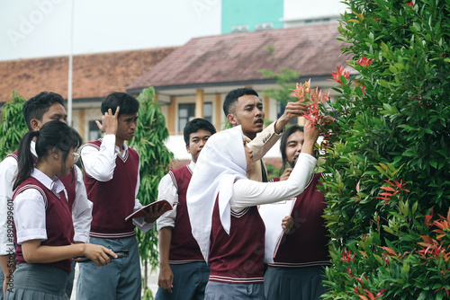 Multiethnic Asian Students Learning Botanical Plants With Young Teacher. Outdoor Classroom