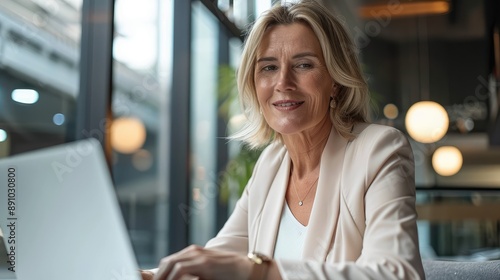  Smiling Mature Woman Working on Laptop 