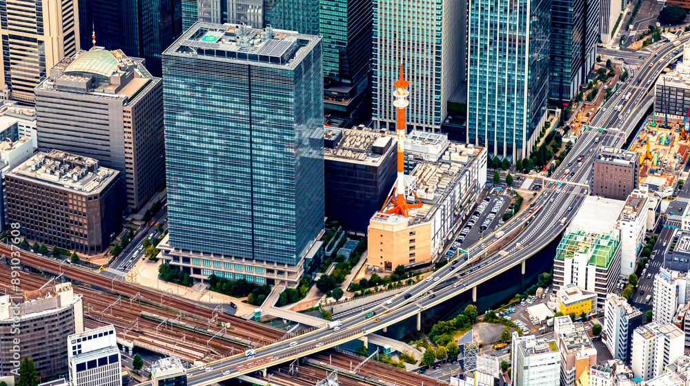 Fototapeta premium Aerial view of skyscrapers and expressways in Marunouchi district, Tokyo Japan