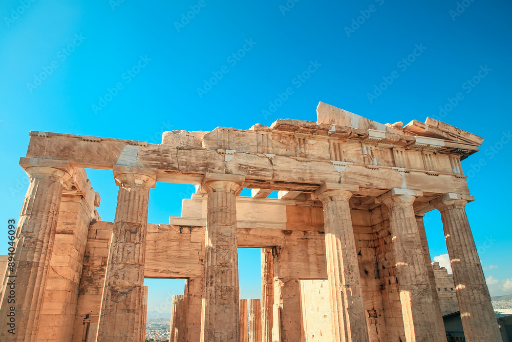 Fototapeta premium Looking up at a columns of Propylaea gateway in Acropolis of Athens, Greece.