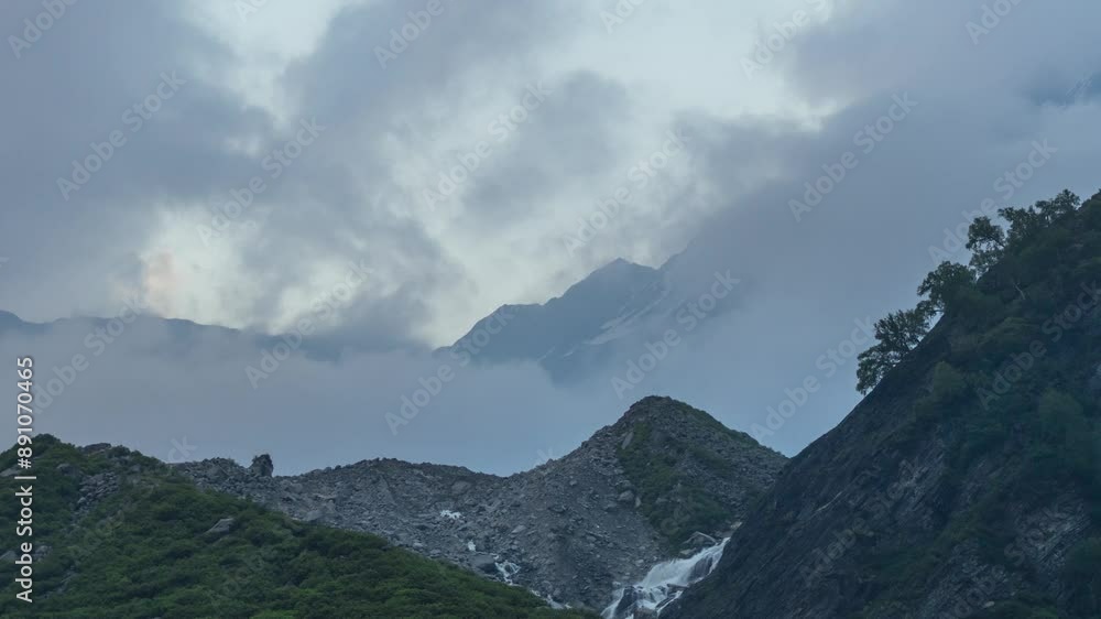 4K timelapse of Beas River flowing as waterfall in mountains near its origin Beas kund in Himachal Pradesh, India. Dark monsoon clouds moving over Himalaya mountains. Mountains and clouds Time Lapse 4K timelapse of Beas River flowing as waterfall in mountains near its origin Beas kund in Himachal Pradesh, India. Dark monsoon clouds moving over Himalaya mountains. Mountains and clouds Time Lapse