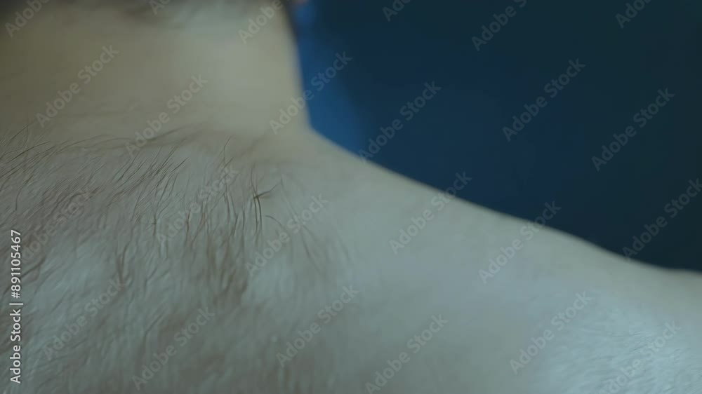 The camera zooms in on raised hairs on the back of the neck as chills run down the spine at the sight of a transparent ghostly being. The camera zooms in on raised hairs on the back of the neck as chills run down the spine at the sight of a transparent ghostly being.