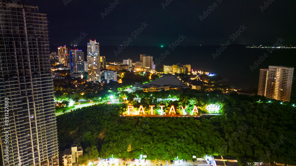 Fototapeta premium aerial of Pattaya Thailand sign city illuminated at night with skyline cityscape