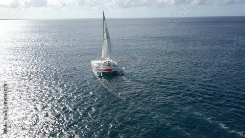 drone shoot of a boat in the caribbean in a sunny day in the sea
