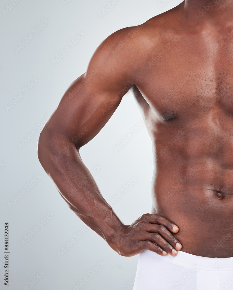Black man, muscle and half of body in studio for fitness, bodybuilding and stomach on white background. Muscular, male athlete and bodybuilder abs with confidence for biceps, health and wellness Black man, muscle and half of body in studio for fitness, bodybuilding and stomach on white background. Muscular, male athlete and bodybuilder abs with confidence for biceps, health and wellness