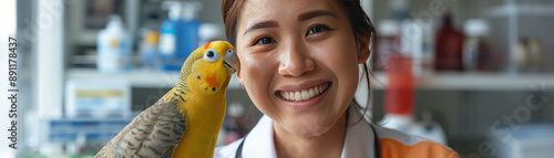 Smiling Veterinarian with Pet Parrot in Veterinary Clinic Setting photo