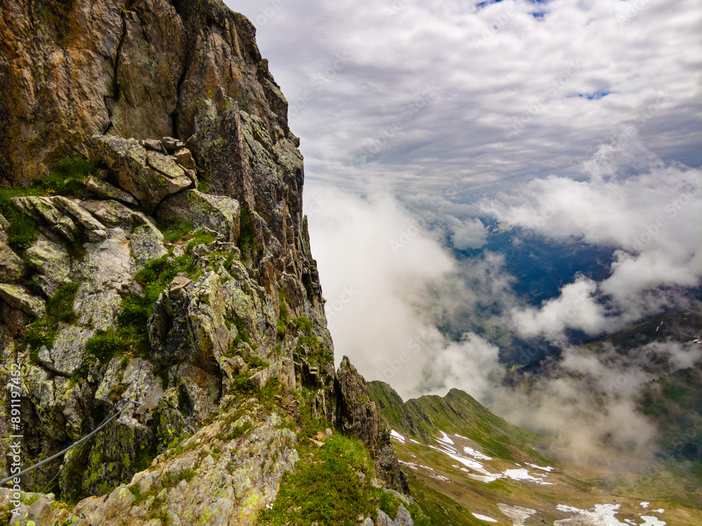 Ascending the Alpine Ridge: A Pathway Through the Clouds (Vorarlberg, Austria) Ascending the Alpine Ridge: A Pathway Through the Clouds (Vorarlberg, Austria)