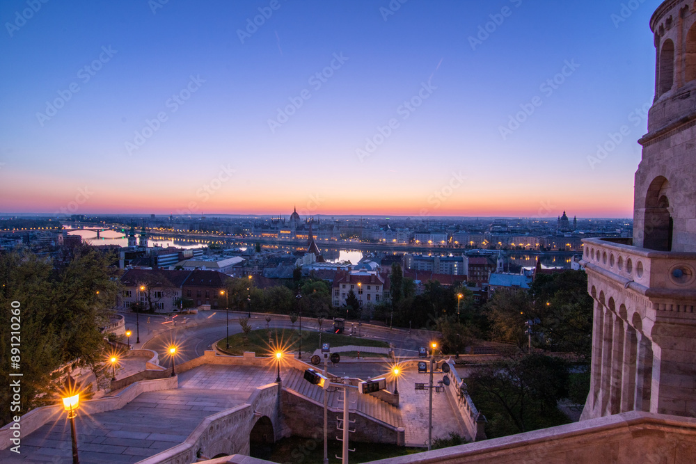 An incredible city view at sunrise or sunset. Extensive city panorama with historical buildings on the Danube. Taken from the mountain side of Buda, the city of Budapest in Hungary An incredible city view at sunrise or sunset. Extensive city panorama with historical buildings on the Danube. Taken from the mountain side of Buda, the city of Budapest in Hungary