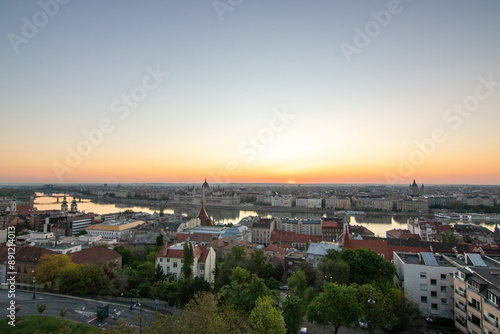 An incredible city view at sunrise or sunset. Extensive city panorama with historical buildings on the Danube. Taken from the mountain side of Buda, the city of Budapest in Hungary