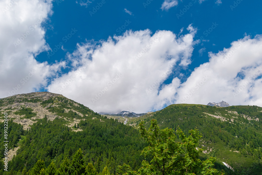 Fototapeta premium Endless Horizons: Alpine Mountain Range with a waterfall (Zillertal, Austria)