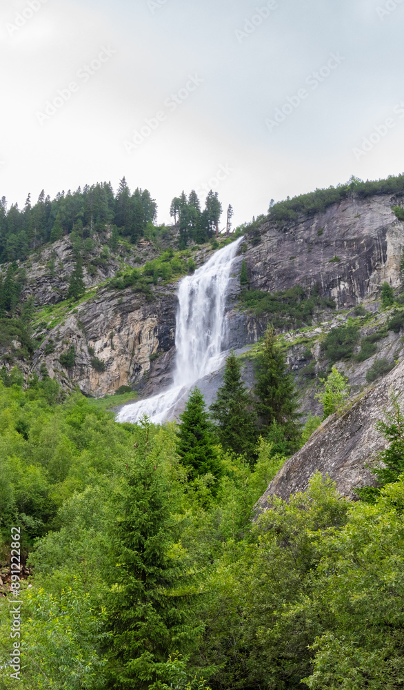 Majestic Mountain Waterfall: Cascading Waters Through Rugged Cliffs (Zemmgrund, AT) Majestic Mountain Waterfall: Cascading Waters Through Rugged Cliffs (Zemmgrund, AT)