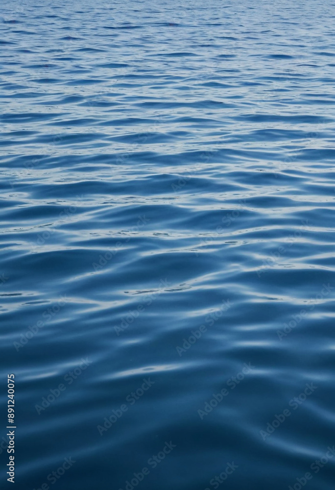 Inner Peace (abstract): Calm blue ocean with ripples fading away, symbolizing serenity. Inner Peace (abstract): Calm blue ocean with ripples fading away, symbolizing serenity.