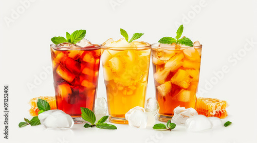 A set of cold soft drinks with different flavors in a glass glass with honey and ice.