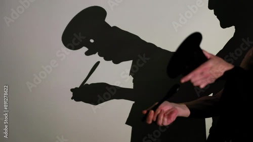 Wallpaper Mural Captivating shadow puppets storytelling scene with intricate hand movements and props on a blank wall, depicting a mysterious narrative Torontodigital.ca