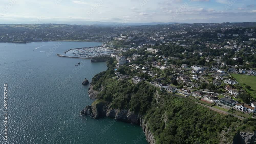 Torquay, Torbay, South Devon, England: DRONE VIEWS: London Arch, the town of Torquay and Torquay marina. Torbay is a popular English holiday destination renowned for its beautiful coastline scenery. Torquay, Torbay, South Devon, England: DRONE VIEWS: London Arch, the town of Torquay and Torquay marina. Torbay is a popular English holiday destination renowned for its beautiful coastline scenery.