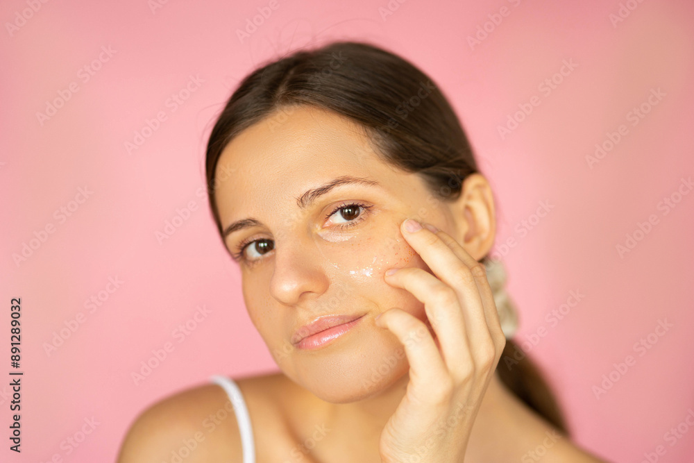 Beautiful woman with smooth skin doing spa procedures, looking relaxed and happy with brown hair Beautiful woman with smooth skin doing spa procedures, looking relaxed and happy with brown hair