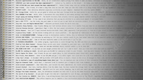 Email inbox overflowing with spam messages, displaying subject lines of various scams and unsolicited offers. Gray interface with yellow folder icons, showcasing a typical cluttered mailbox.
