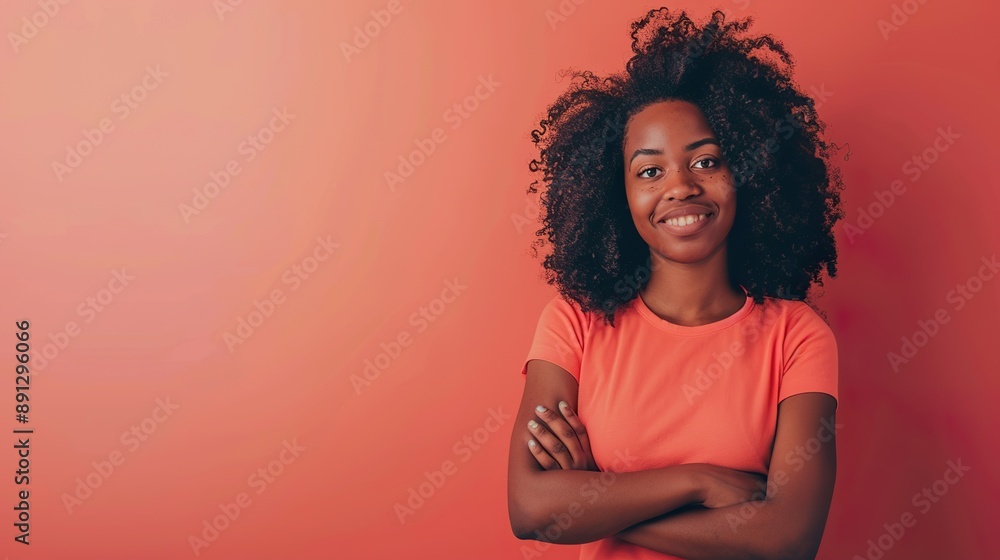 a cheerful woman posing with crossed arms, against a coral background, exuding positivity and vibrancy, with space next to her for text or graphics. a cheerful woman posing with crossed arms, against a coral background, exuding positivity and vibrancy, with space next to her for text or graphics.