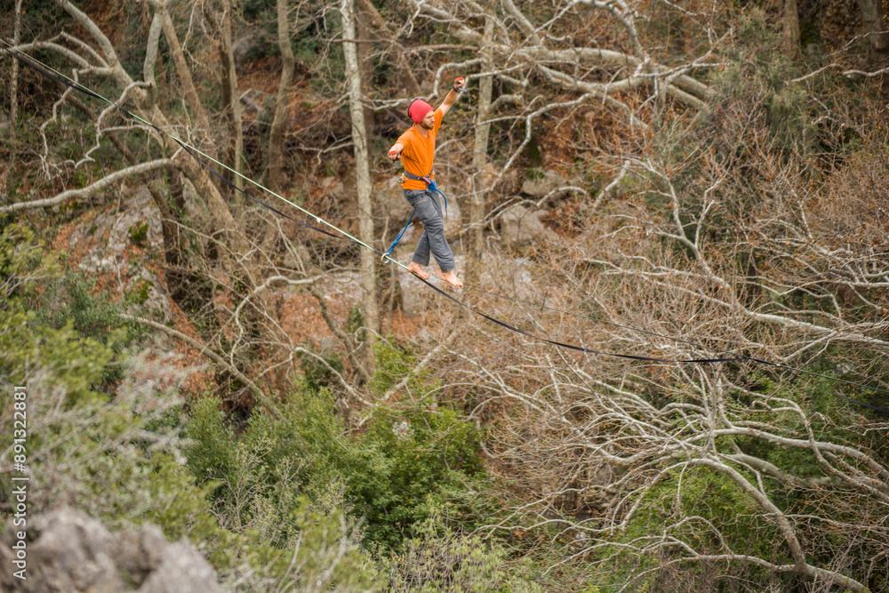 custom made wallpaper toronto digitalA tightrope walker walks along a rope stretched over a conyon.
