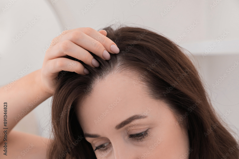 Naklejka premium Woman with hair loss problem at home, closeup