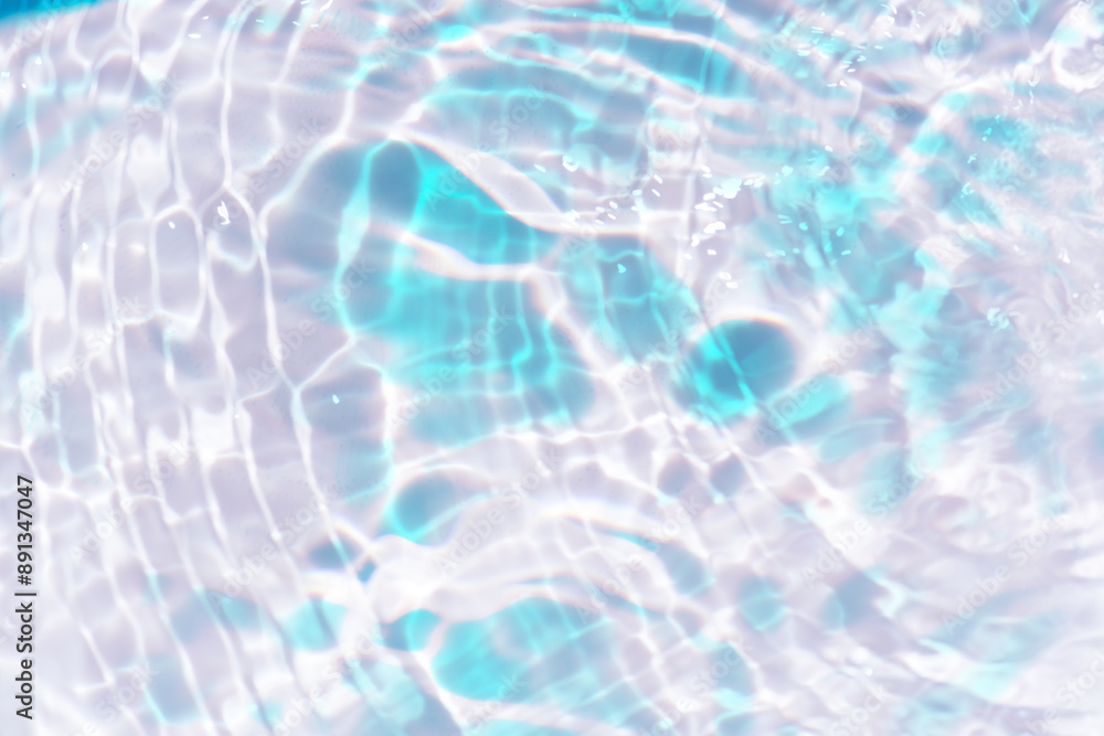 Blue water with ripples on the surface. Defocus blurred transparent blue colored clear calm water surface texture with splashes and bubbles. Water waves with shining pattern texture background. Blue water with ripples on the surface. Defocus blurred transparent blue colored clear calm water surface texture with splashes and bubbles. Water waves with shining pattern texture background.