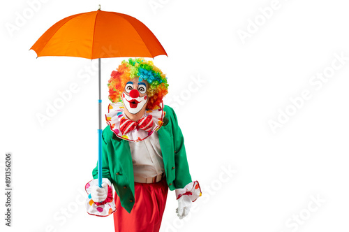 Obraz na plátně Clown holding orange umbrella
