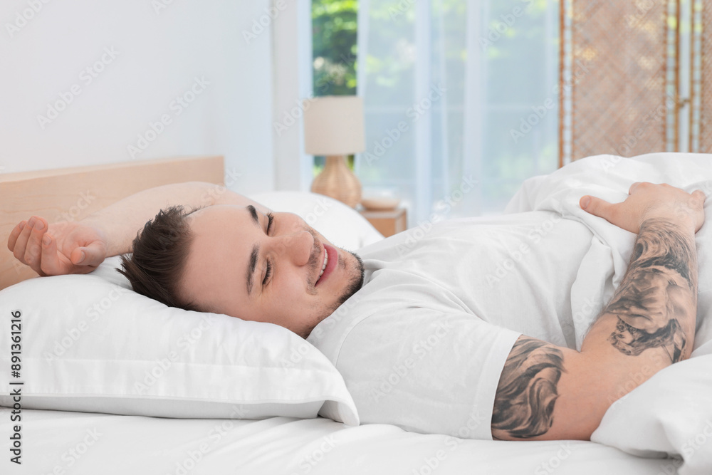 Bedtime. Handsome man sleeping in bed indoors Bedtime. Handsome man sleeping in bed indoors