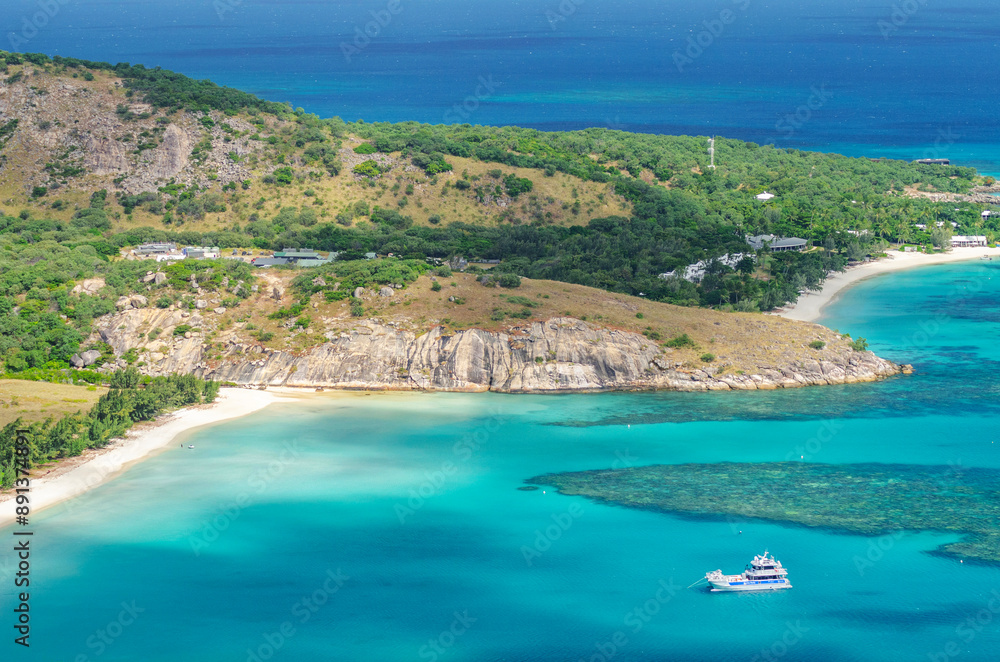 Obraz premium Picturesque aerial view on tropical sandy Watsons Beach with turquoise water on Lizard Island, Australia. Lizard Island  is located on Great Barrier Reef in north-east part of Queensland.