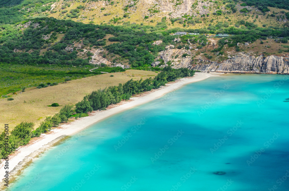 Picturesque aerial view on tropical sandy Watsons Beach with turquoise water on Lizard Island, Australia. Lizard Island  is located on Great Barrier Reef in north-east part of Queensland.