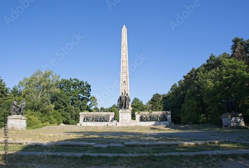 Sofia, Bulgaria - Jul 7, 2024: Sofia Partisan War Cemetery. People walking in Ancient Serdica. Streets and buildings. Lifestyle in the urban area. Sunny day. Selective focus photo