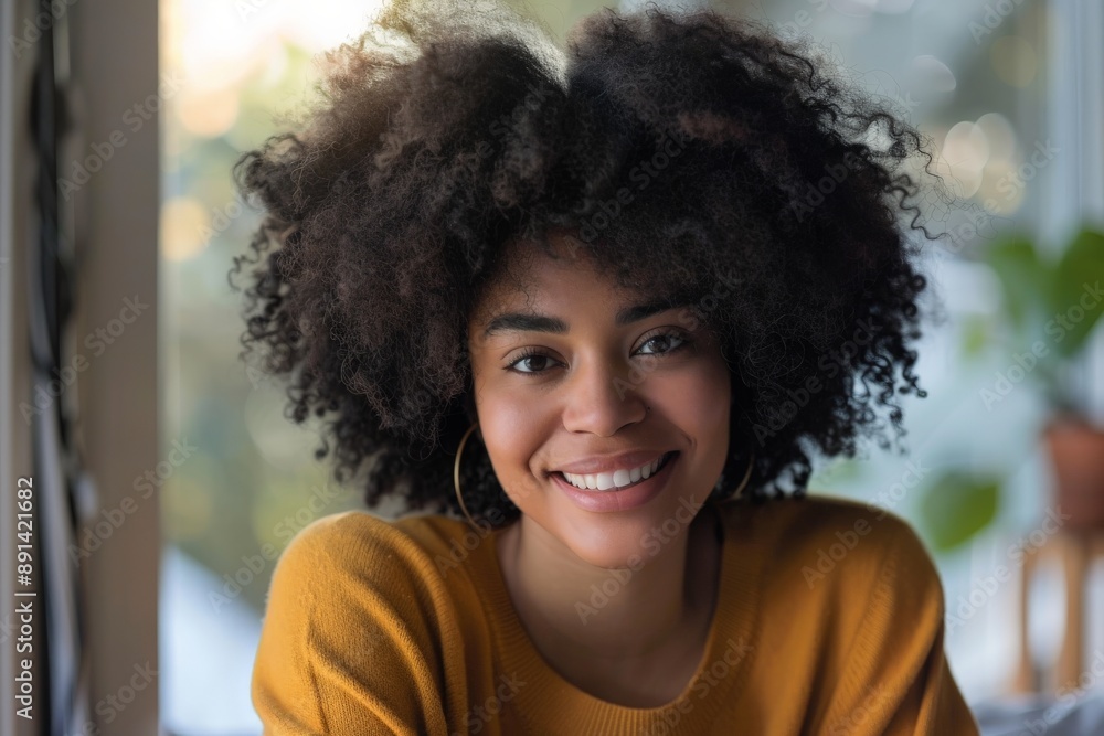 Beautiful black woman with afro hair style smiling at home Beautiful black woman with afro hair style smiling at home