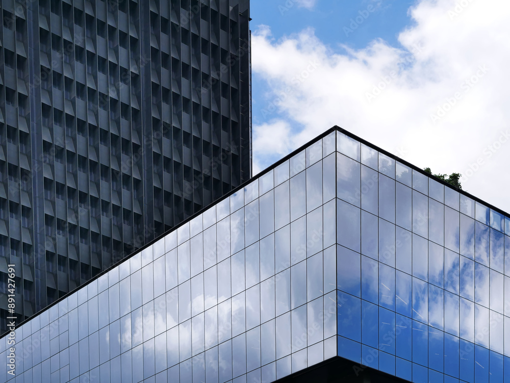 Low Angle View of Modern Buildings with Sky Reflection on Windows Low Angle View of Modern Buildings with Sky Reflection on Windows