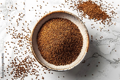 A Close-Up of Brown Mustard Seeds in a Bowl on a Marble Surface