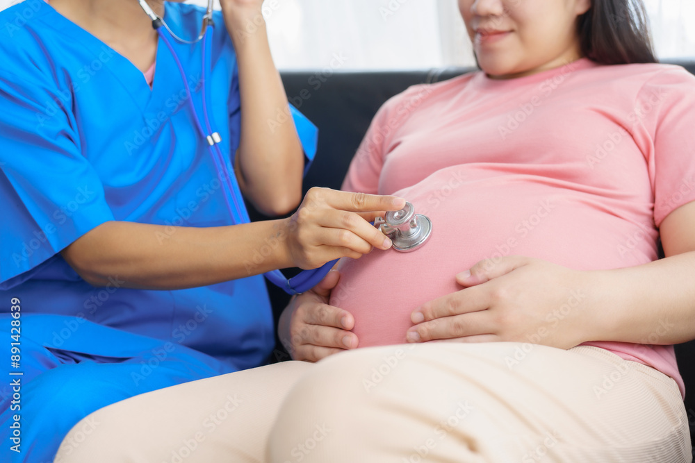 Obraz premium Pregnant mothers meet the nurse at the clinic as scheduled, reviewing their medical history and discussing symptoms. Sitting on the sofa, they report headaches, nausea, and back pain to the nurse.